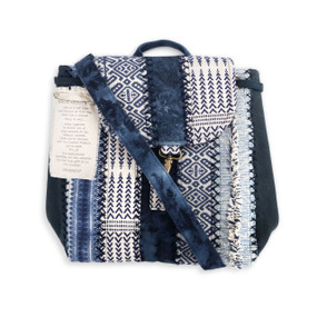 An indigo multi patterned "Your Journey" backpack.