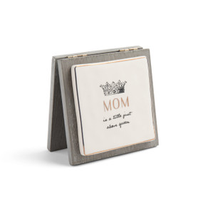 A gray wooden card with a ceramic plate that reads "Mom is a title just above queen".