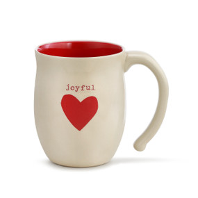 A red and ivory mug with "joyful" engraved over a red heart.