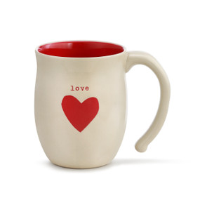 A red and ivory mug with "love" engraved over a red heart.