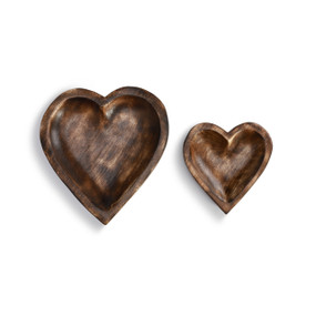 A set of two wooden heart shaped bowls.