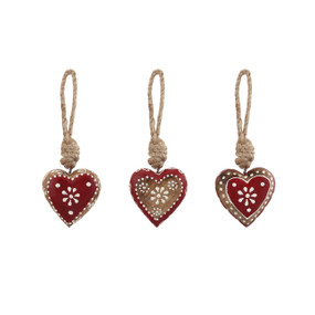 Three small gingerbread style wood heart shaped ornaments painted red and white
