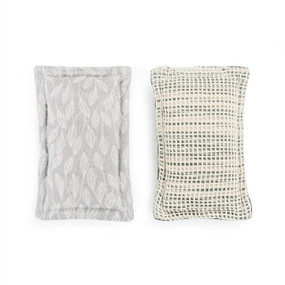 The front and back of a gray leaf print kitchen sponge.