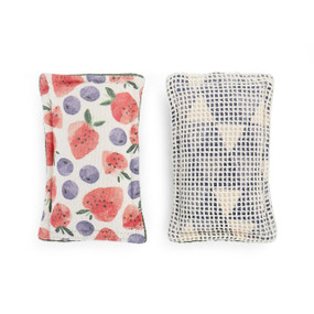 The front and back of a strawberry print kitchen sponge.