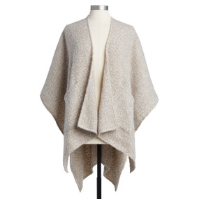 A soft textured ivory prayer shrobe placed on an ivory and black mannequin.