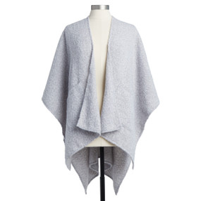 A soft textured light gray Prayer Shrobe placed on an ivory and black mannequin.