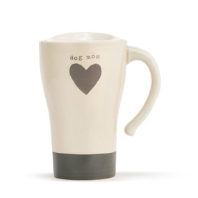 A tapered, cream, ceramic travel coffee mug, with a thick gray stripe base, a single gray heart in the center, and reads dog mom" in a gray typewriter font. With a handle, and lid placed on top."