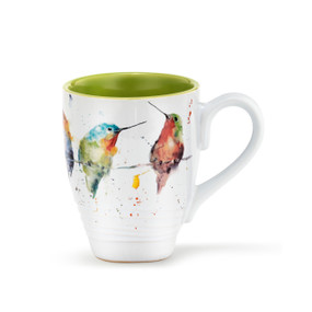 A white ceramic coffee mug with several watercolor painted birds around the outside, and a green inner lining.