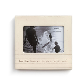 A textured cream colored picture frame, with thin brown stripes, reads Dear Mom, thank you for giving me the world." in brown typewriter font, and is filled with a family photo."