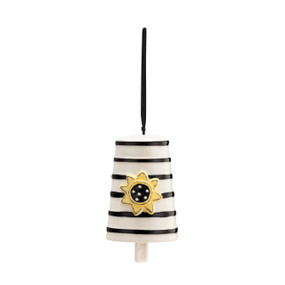 A hanging white Heartful Home Bell" with black stripes, a yellow sunflower in the center, a chime that reads "friend", and a black ribbon string."