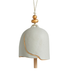 A cream Inspired Bell" with a single gold painted crack, a twine rope, and gold and wooden beads."