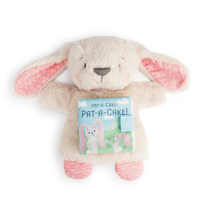 A soft, plush, tan and pink bunny with a soft book on its stomach that reads 'Pat-a-cake!'.