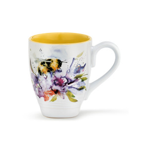 A white ceramic coffee mug with several watercolor painted flowers and bees around the outside, and a yellow inner lining.