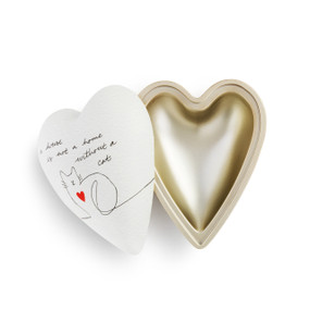A white Art Heart with a brushed gold inner lining. Outside is white with a drawing of a cat, and reads a house is not a home without a cat" in black script."