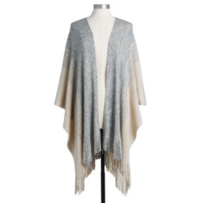 A soft blue and ivory, stripe textured wrap, with a fringed bottom edge. Placed on a black and white mannequin.