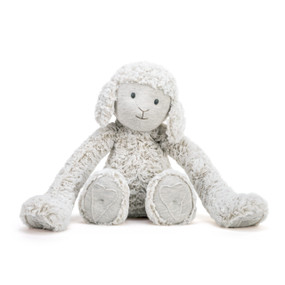 A front facing view of a plush white and gray lamb with long arms and a heart outline on its paws.