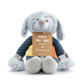 A blue plush puppy wearing a dark blue jacket withe a brown cardboard packaging tag attached.