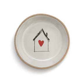 A cream round ceramic treasure keeper dish with tan textured rim with an image of a scribble house with a red heart.