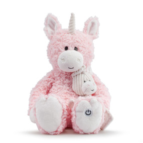 Front facing view of a pink plush sitting unicorn holding a smaller unicorn in its lap.