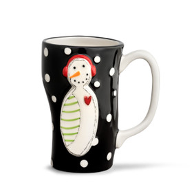 A tall black mug with several white polka dots, and a white snowman with a red heart, green stripes, and red ear muffs.