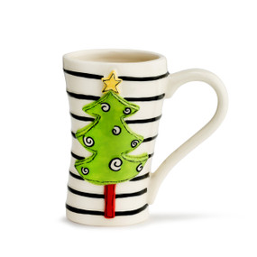 A tall cream mug with thin black stripes, and a green tree with a bright yellow star and several black swirls.