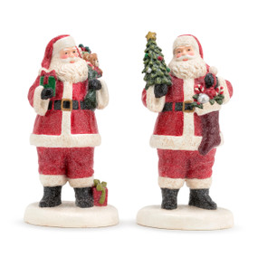A set of two paper pulp Santa figures, one holding a green sack filled with presents, and one holding a Christmas tree and a stocking.