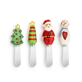A set of four Christmas themed silver spreading knives. Two topped with a Christmas tree, one with a Santa, and one with a snowman.