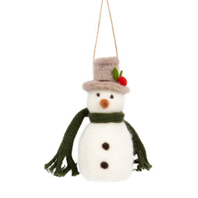 A white felt snowman ornament wearing a green knit scarf and a light brown felt top hat with a red felt flower adornment.