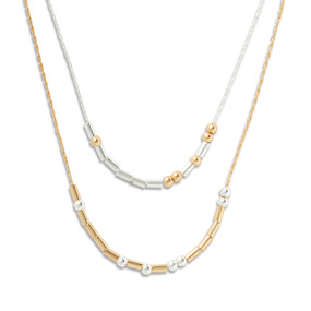 Silver and gold necklace with rods and beads spelling out morse code with the theme of not being alone.
