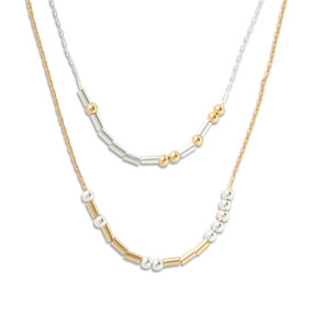 Silver and gold necklace with rods and beads spelling out morse code with the theme of being enough.