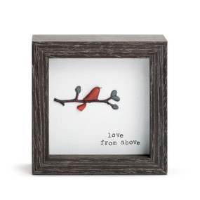 A square dark wood shadow box with a stone red bird on a branch  that says "love from above".