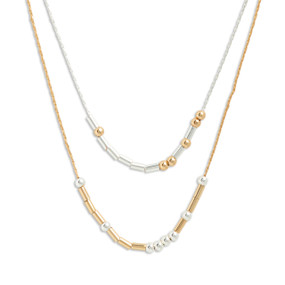 Silver and gold necklace with rods and beads spelling out morse code with the theme of being amazing.