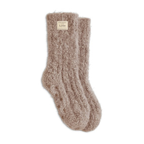 A pair of camel colored fuzzy socks.