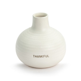 Cream round stoneware vase that says "Thankful". The vase has a ripple texture and narrows to a small round opening.