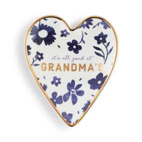 Heart shaped ceramic dish with a gold rim. The interior is blue flowers and says "it's all good at Grandma's".
