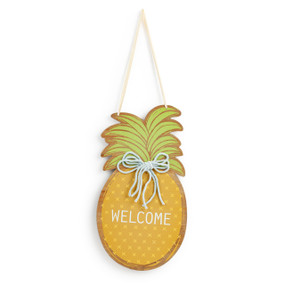 A pineapple shaped wood hanging door decoration that says "Welcome" and has a light gray yarn bow.