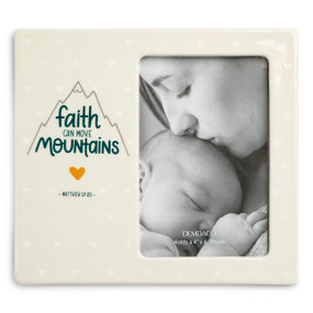 A cream ceramic 4" x 6" photo frame that says "faith can move mountains" on the left and the opening for the photo on the right.