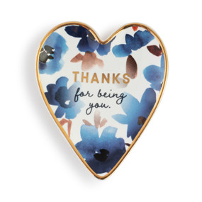 Heart shaped ceramic dish with a gold rim. The interior has blue flowers and says "Thanks for being you".