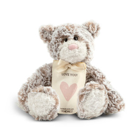 A gray and brown plush bear with a pink nose and a cream tag tied around its neck that says "Love You!"