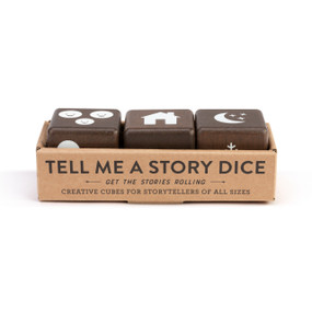 Set of three dark brown wood dice with simple images on each side in white such as a house, flower, plane or clock, displayed in a cardboard packaging box.