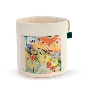 Round cream colored canvas planter bag with a colorful image of flowers and dragonflies on the front.