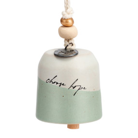 A mini cream and light green bell that says "choose hope". There are beads and a metal token at the top of the bell.