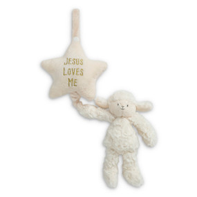 A white plush lamb hanging from a white plush star that says "Jesus Loves Me" in gold.