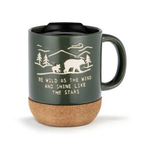 Dark green cork bottom mug with a black travel lid. The mug says "Be Wild as the Wind and Shine Like the Stars" and has the image of bears walking through wilderness.