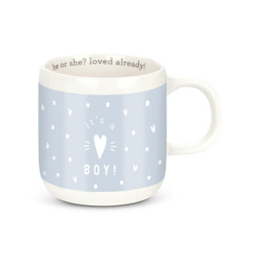 A white mug that is black without liquid but will turn blue with hot liquid and says "he or she? loved already!" on the inside rim.