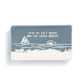 Blue and white rectangular spoon rest that says "Give Me Salt Water and the Ocean Breeze" with the image of a sailboat on the water.