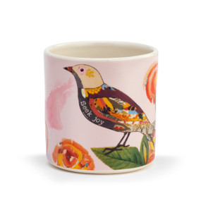 Light pink stoneware planter with a colorful bird and flowers that says "Seek Joy".