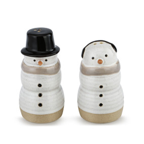 Two white and beige snowman shaped salt and peper shakers.