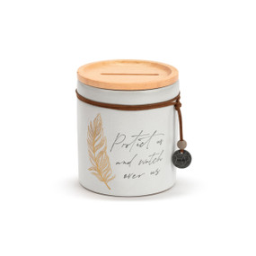 A white round ceramic container that says "Protect us and watch over us" with the image of a feather. The container has a wood lid with an open slot and a leather cord around the jar with a metal token that says "angel".