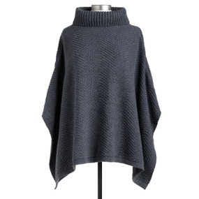 A charcoal colored cowl neck poncho with a zigzag weave pattern displayed on a mannequin.